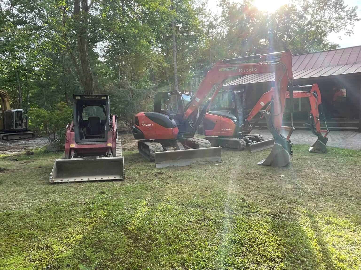 Nyman Services equipment lineup: a Takeuchi track loader and Kubota KX080 and KX040 excavators